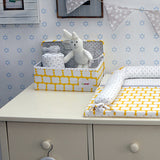 yellow storage box for changing tables and use in cupboards